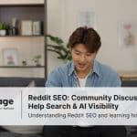 Photo of a young man using social media on his phone, representing Reddit SEO