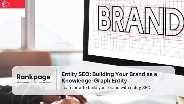 Photo of a man working at a PC with the word 'brand' on the screen, representing entity SEO